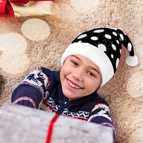Prskanje crne boje na bijelom božićnom šeširu Djeda Mraza za crveni Božićni šešir blagdanske usluge Božićni pribor za blagdanske